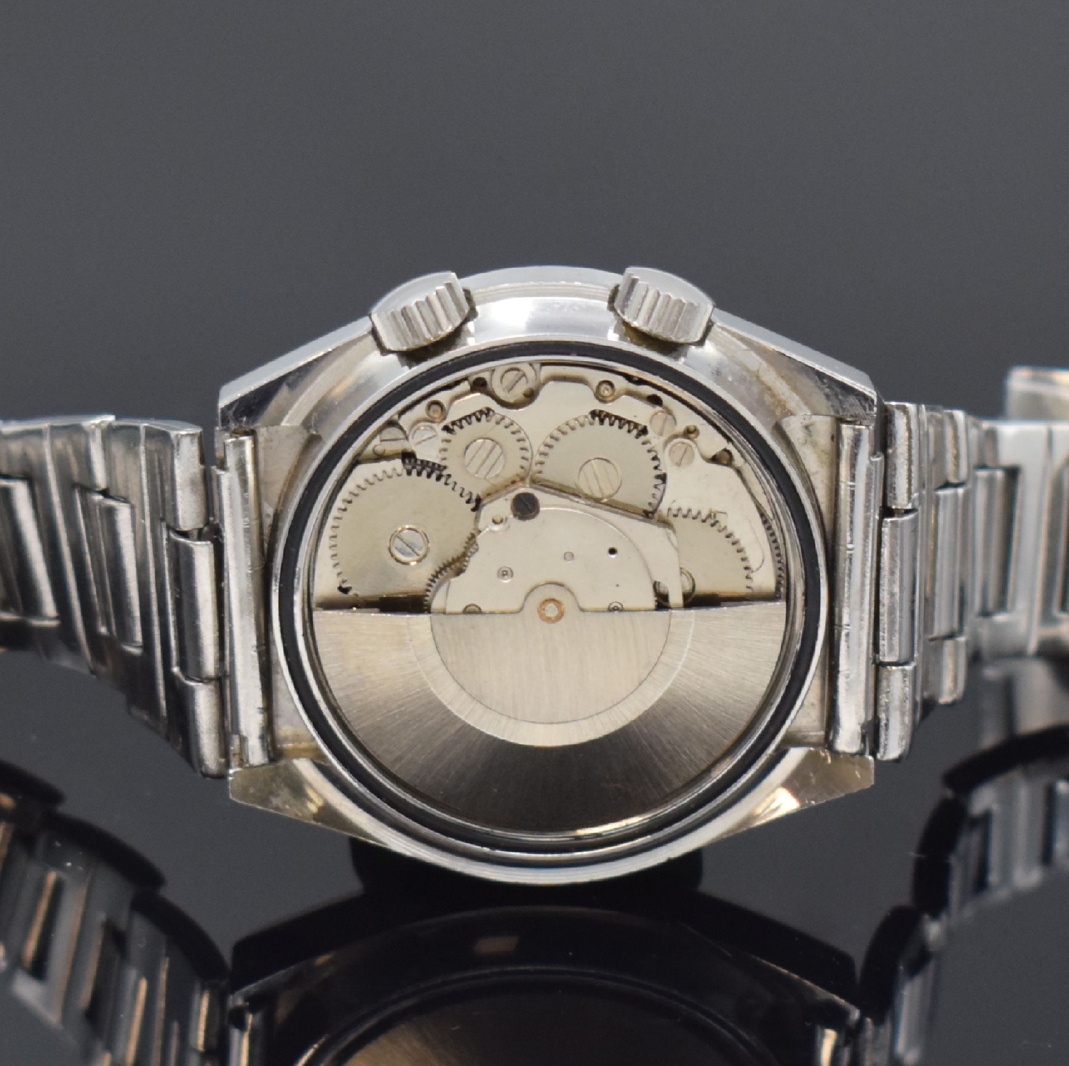 Detail d: PREDIAL Herrenarmbanduhr mit Wecker in Stahl, Schweiz um 1970, Automatik, tonneauförm. Geh., Boden verschr., neutr. Stahlband m. Faltschl., silb. ...