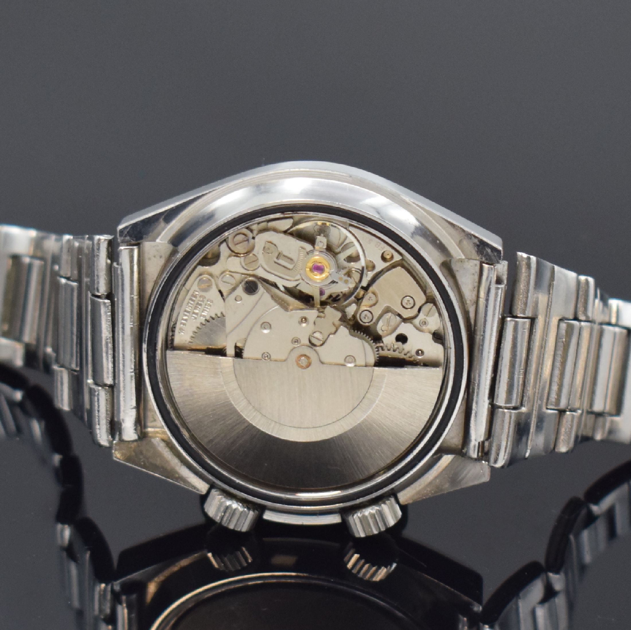 Detail e: PREDIAL Herrenarmbanduhr mit Wecker in Stahl, Schweiz um 1970, Automatik, tonneauförm. Geh., Boden verschr., neutr. Stahlband m. Faltschl., silb. ...