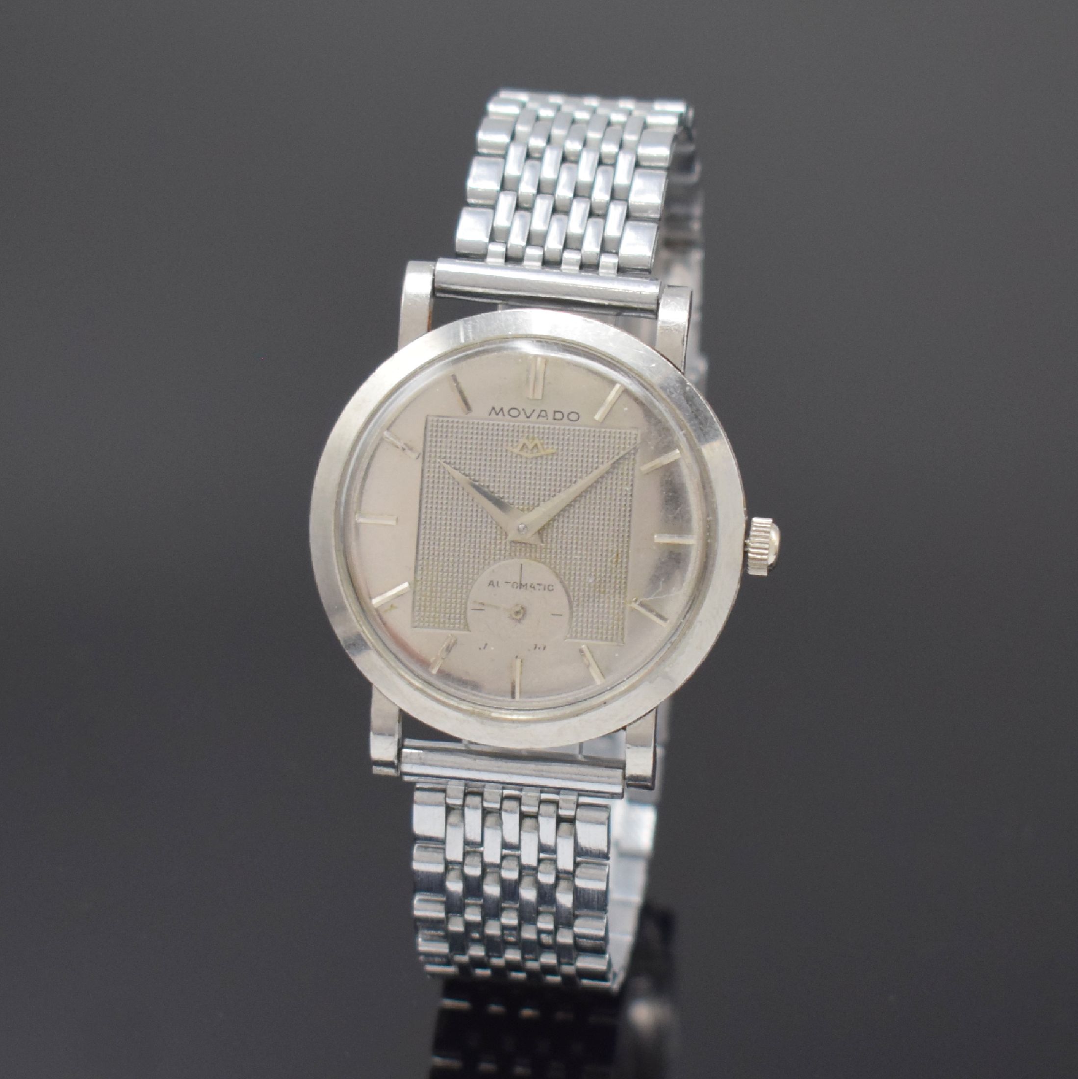 MOVADO Herrenarmbanduhr in Stahl Referenz 18463, Schweiz um 1950, Hammerautomatik, neutr. Band, Boden aufgedr., Zifferbl. m. silb. Std.-Ind. u. ...