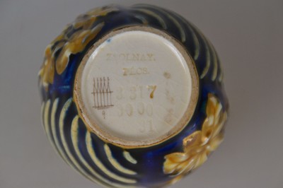 26704504d - Decorative vase, Vilmos Zsolnay, Pecs, Hungary, around 1878, ceramic, cream-colored body, royal blue glazed, gold decoration, floral and wave decoration in relief, edge with breakthrough work, form 3317 used 1873 - 1879, mark 1878-1896, traces of age, H. 6.1 cm, D. 7 cm