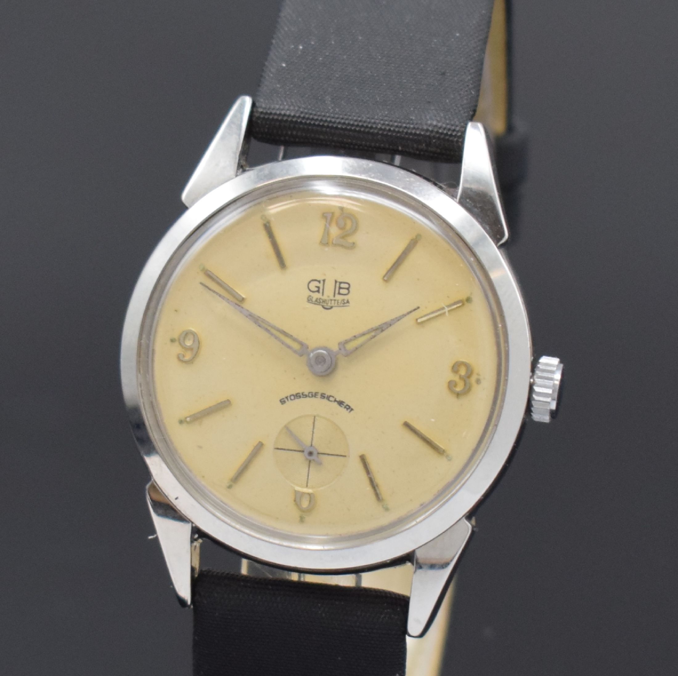 Detail a: GUB Glashütte Armbanduhr im ROWI Gehäuse, Deutschland um 1950, Handaufzug, Geh. in Stahl, Boden verschr., Zifferbl. rest., aufges. Std.-Ind., ...