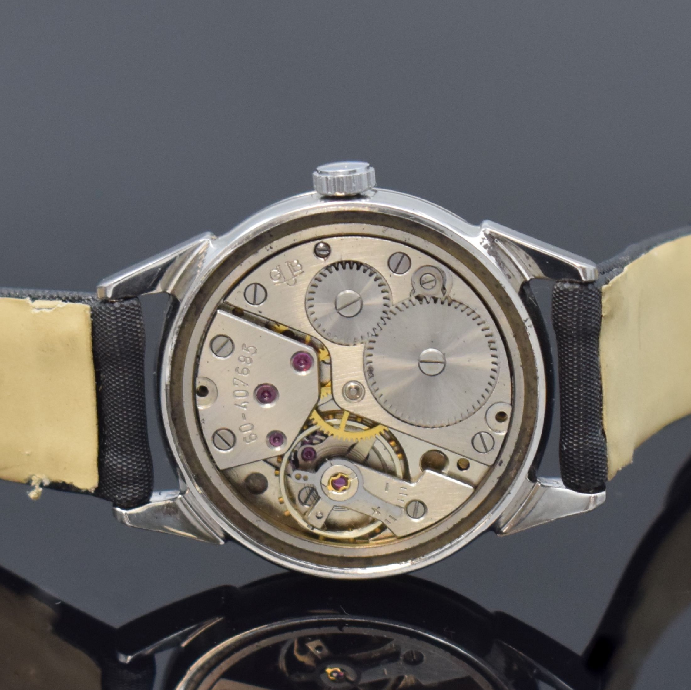 Detail d: GUB Glashütte Armbanduhr im ROWI Gehäuse, Deutschland um 1950, Handaufzug, Geh. in Stahl, Boden verschr., Zifferbl. rest., aufges. Std.-Ind., ...