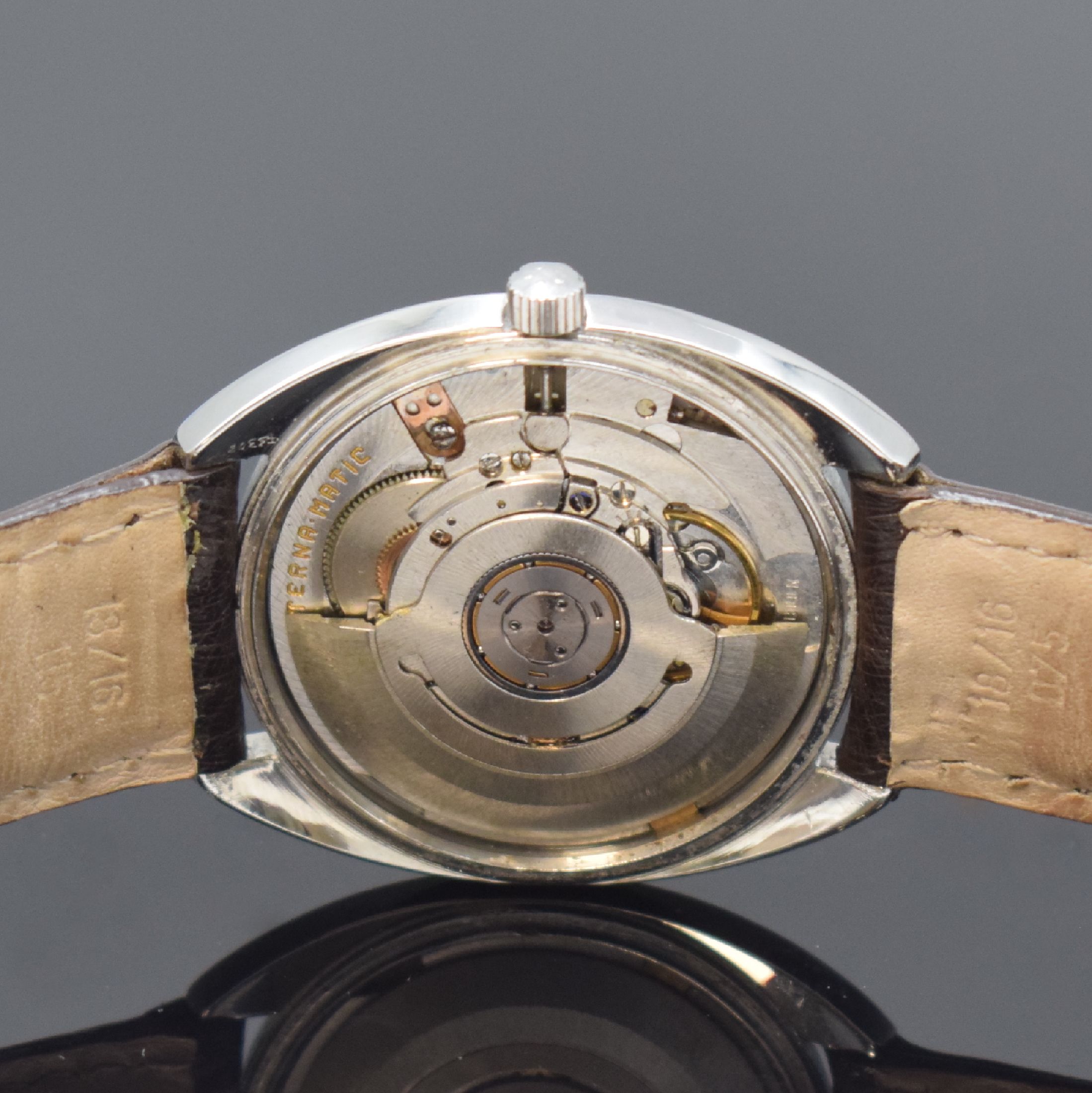 Detail d: ETERNA MATIC Herrenarmbanduhr in Stahl Referenz 149 T, Automatik, Schweiz um 1970, silb. Zifferbl. m. aufgel. Indizes altersbed. fl./pat., Datum b. ...