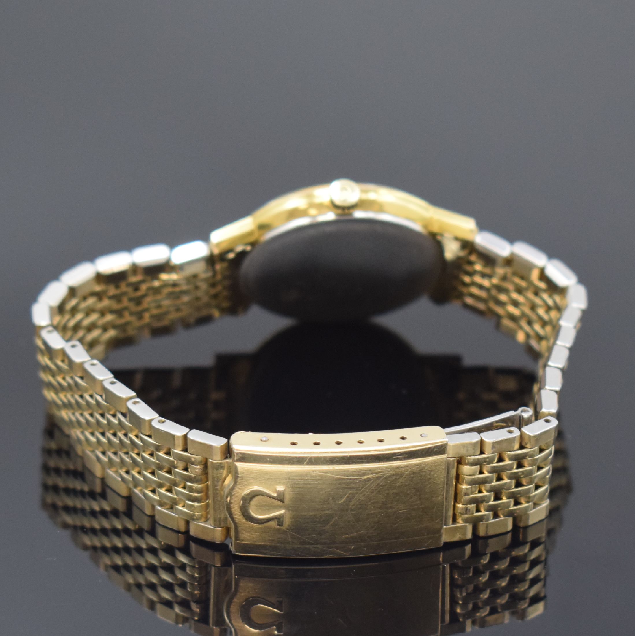 Detail b: OMEGA Geneve Herrenarmbanduhr Referenz 131.019, Schweiz um 1969, Handaufzug, verg. Metallgeh. inkl. orig. Gliederband, Edelst.- Boden aufgedr., ...