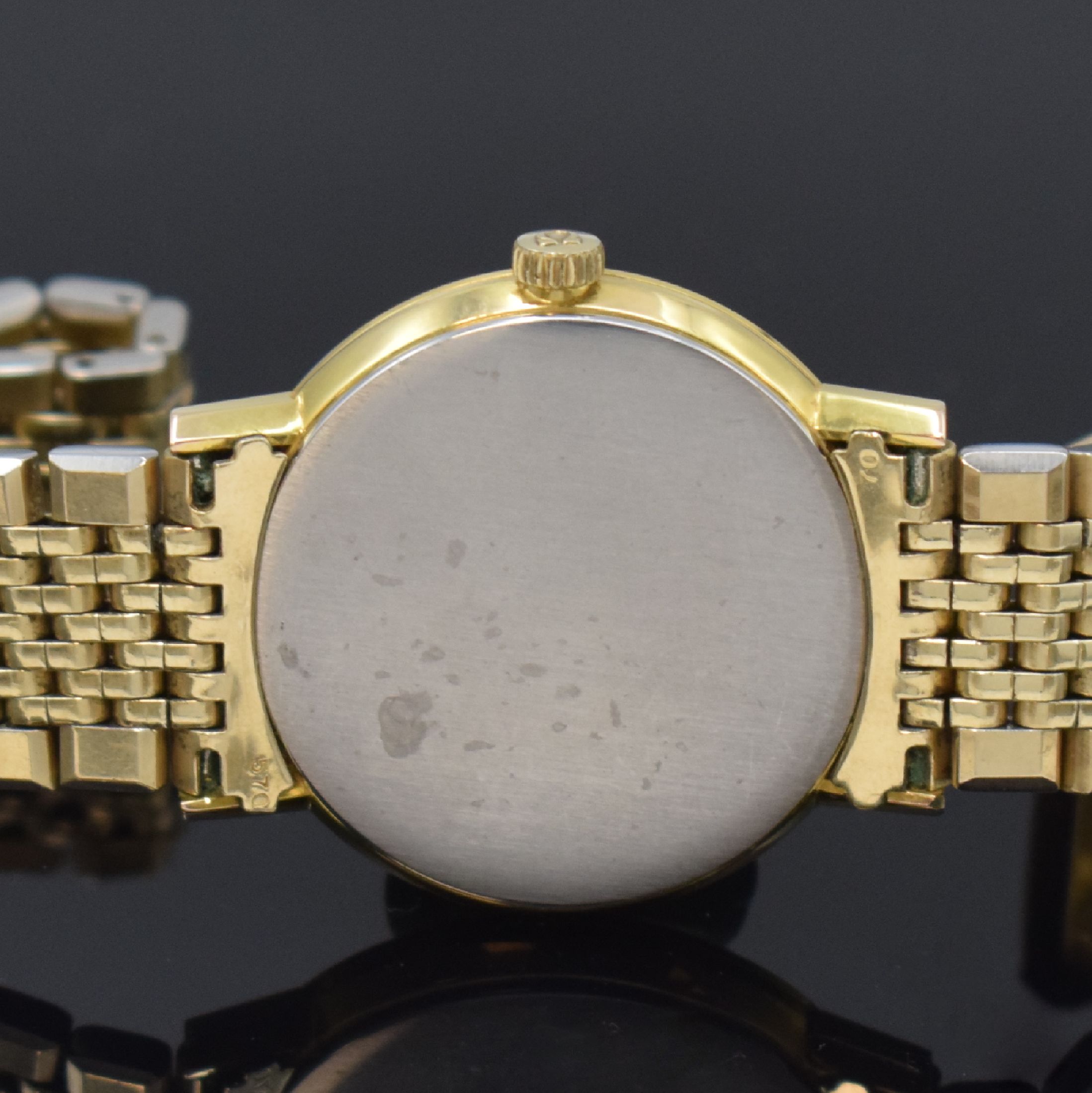 Detail d: OMEGA Geneve Herrenarmbanduhr Referenz 131.019, Schweiz um 1969, Handaufzug, verg. Metallgeh. inkl. orig. Gliederband, Edelst.- Boden aufgedr., ...