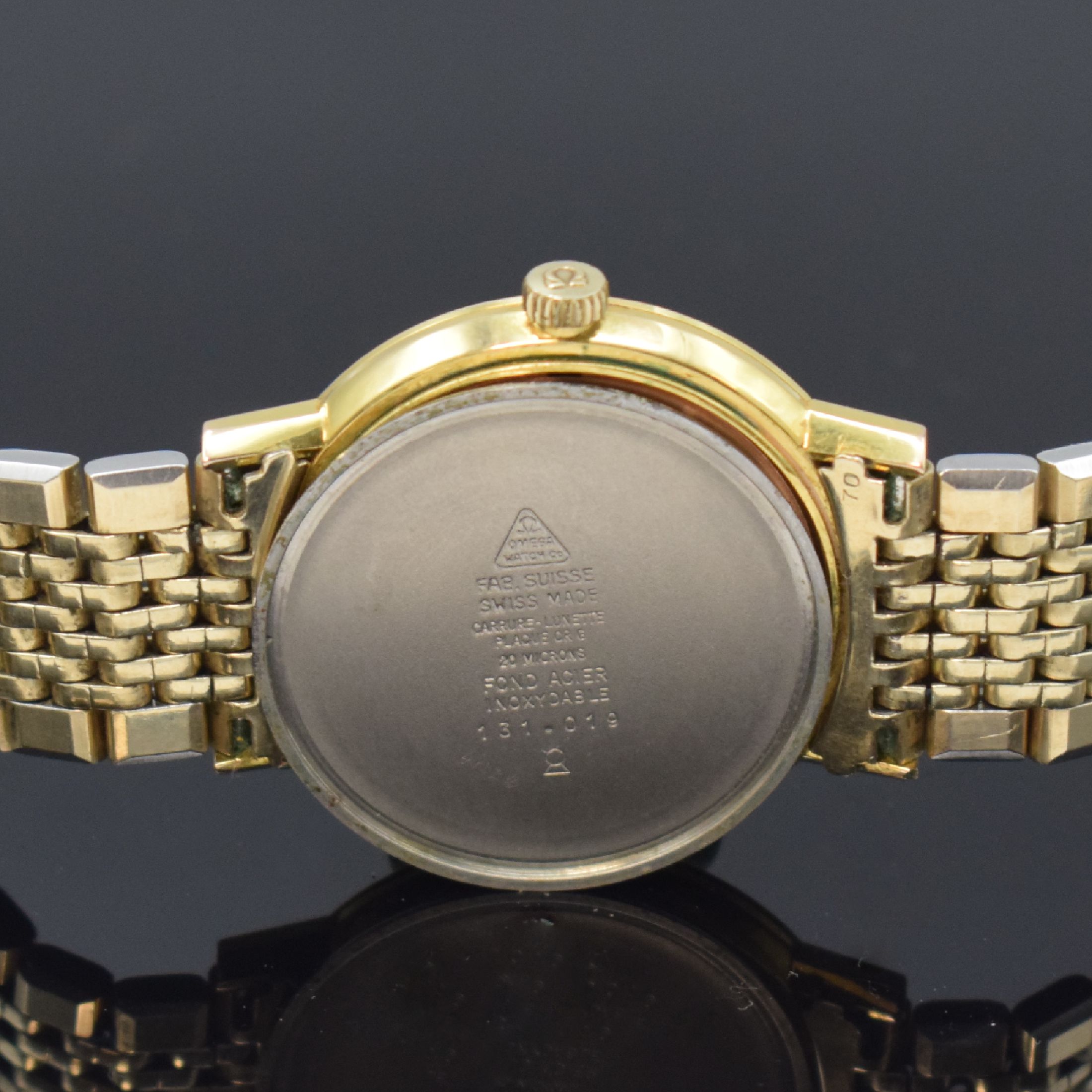 Detail f: OMEGA Geneve Herrenarmbanduhr Referenz 131.019, Schweiz um 1969, Handaufzug, verg. Metallgeh. inkl. orig. Gliederband, Edelst.- Boden aufgedr., ...