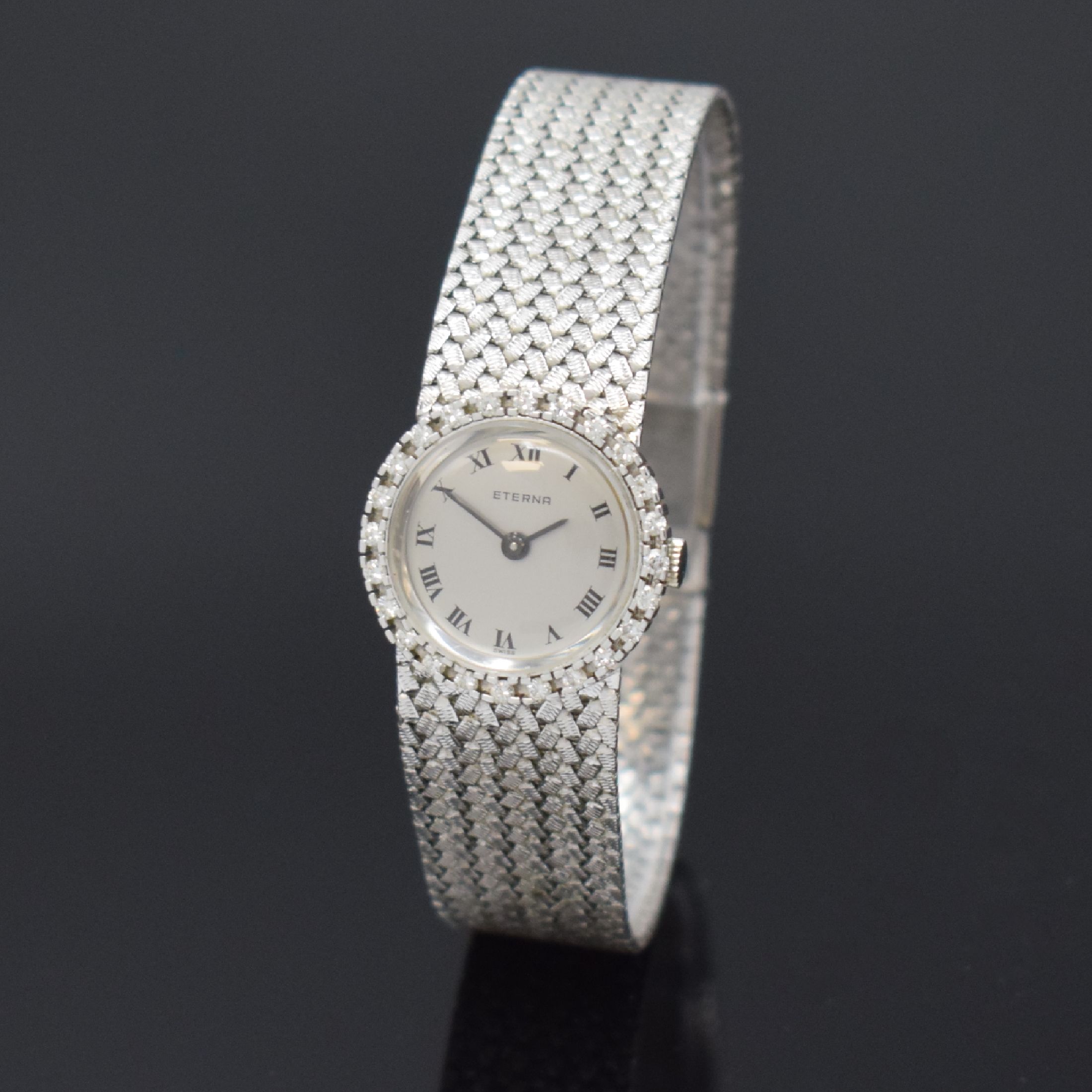 ETERNA Damenarmbanduhr in WG 750/000, Schweiz um 1970, Handaufzug, 2-teil. Gehäuse, Boden aufgedr., Lünette m. Diamanten bes., silb. Zifferbl. m. ...