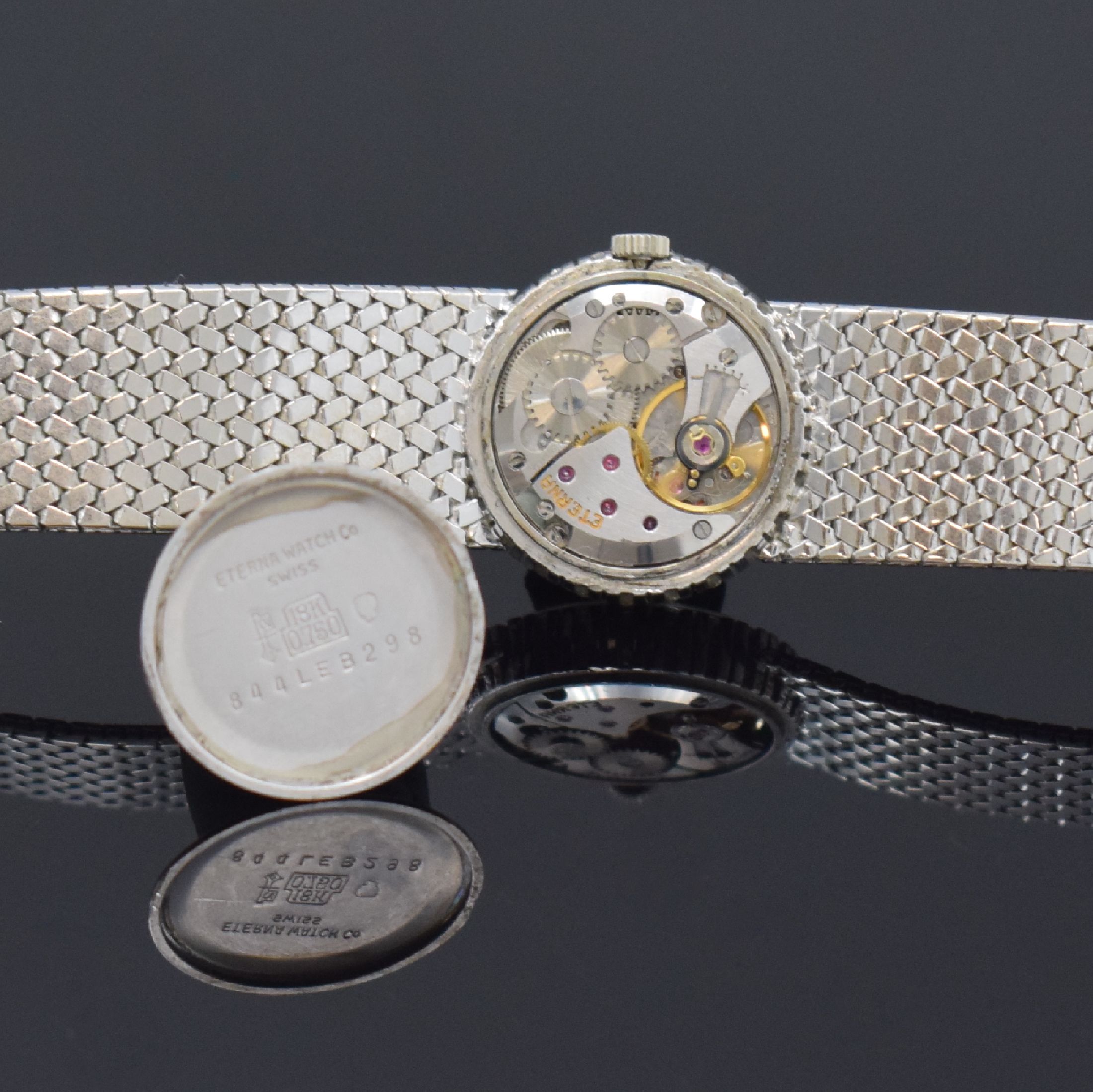 Detail e: ETERNA Damenarmbanduhr in WG 750/000, Schweiz um 1970, Handaufzug, 2-teil. Gehäuse, Boden aufgedr., Lünette m. Diamanten bes., silb. Zifferbl. m. ...
