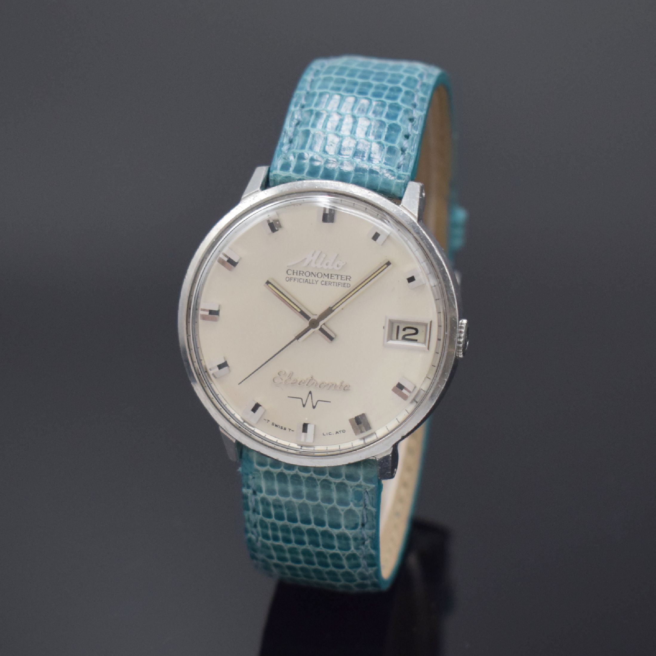 MIDO Chronometer Electronic seltene Herrenarmbanduhr in Stahl Referenz 7007, Schweiz um 1965, electro-mechanisch, Monocoque-Geh., silb. Zifferbl., ...