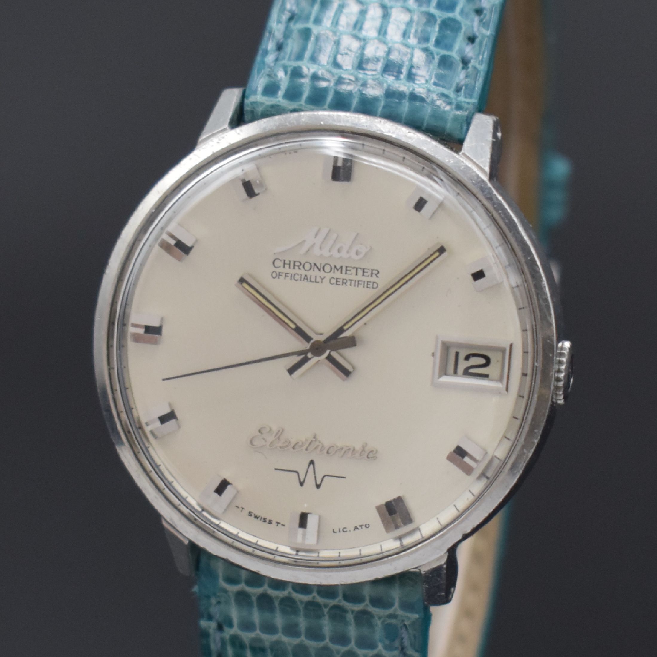 Detail a: MIDO Chronometer Electronic seltene Herrenarmbanduhr in Stahl Referenz 7007, Schweiz um 1965, electro-mechanisch, Monocoque-Geh., silb. Zifferbl., ...