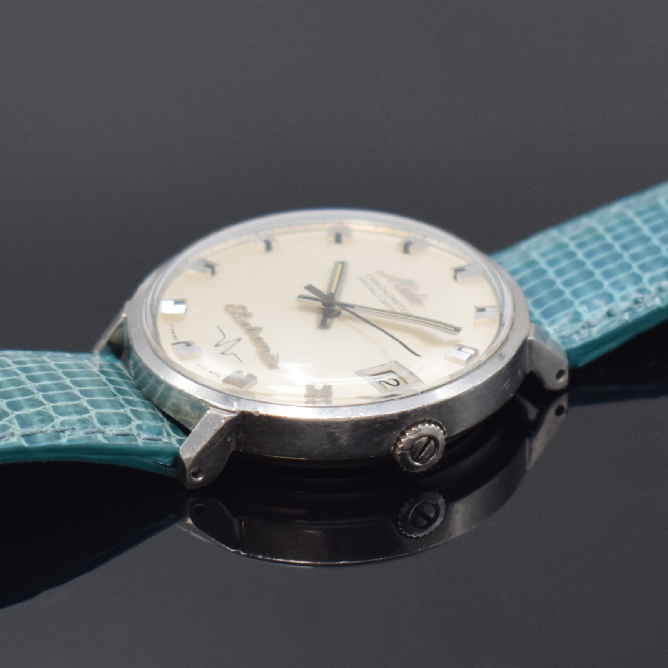Detail b: MIDO Chronometer Electronic seltene Herrenarmbanduhr in Stahl Referenz 7007, Schweiz um 1965, electro-mechanisch, Monocoque-Geh., silb. Zifferbl., ...