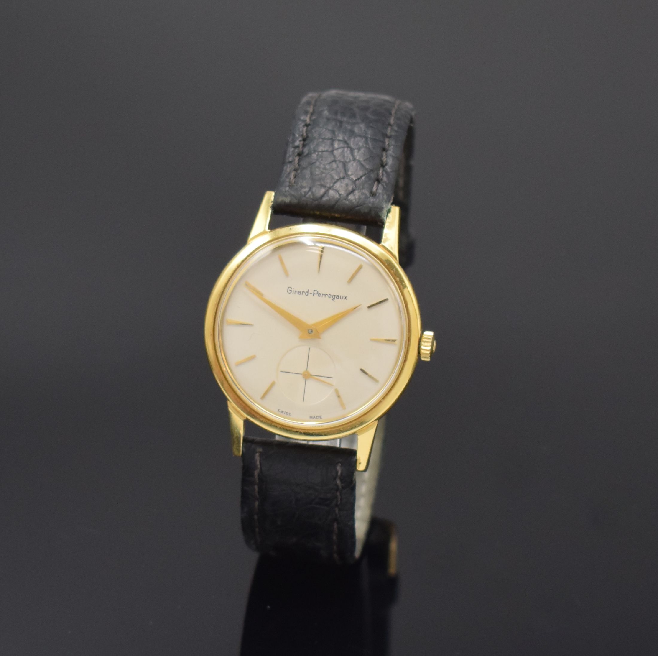 GIRARD PERREGAUX Armbanduhr in GG 750/000, Schweiz um 1955, Handaufzug, Boden verschr., silb. Zifferbl. rest., gold. Std.-Ind., gold. Zeiger, kl. ...