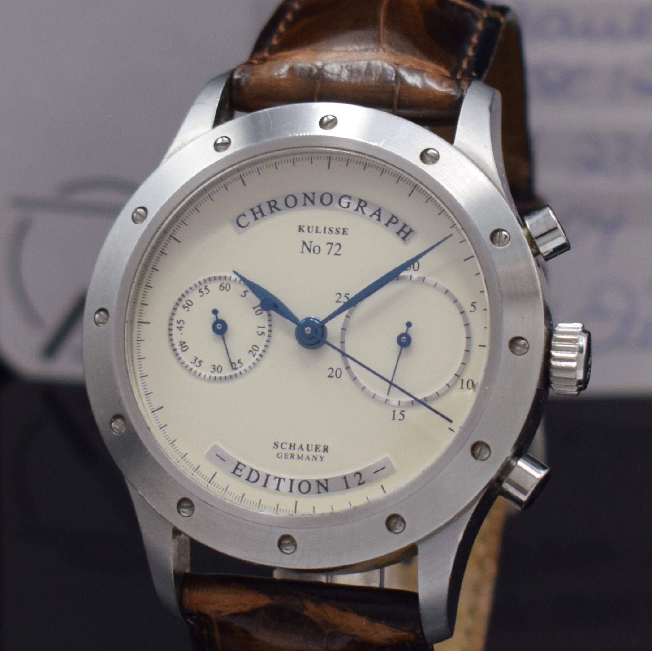 Detail a: SCHAUER Kulisse Edition 12 Armbandchronograph in Stahl, Deutschland verk. lt. beil. Pap. 06/2004, Automatik, beids. verg. Geh., Boden verschr., orig. ...