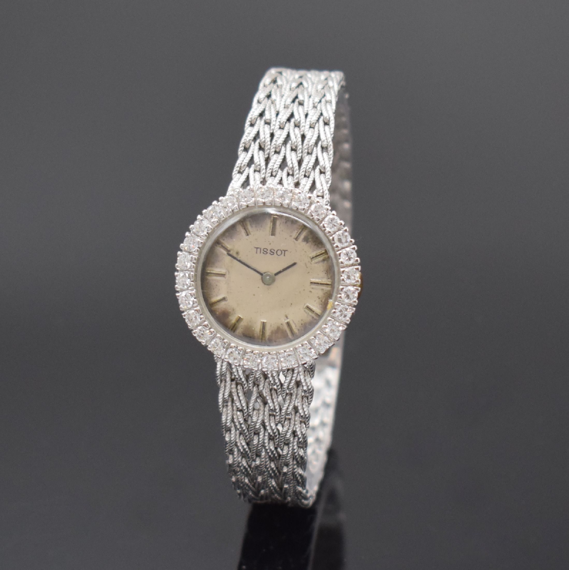 TISSOT Damenarmbanduhr in WG 750/000 mit Diamanten, Schweiz um 1965, Handaufzug, Lünette aufw. m. Diamanten bes. (ca. 0,8ct), silb. Zifferbl. stark ...