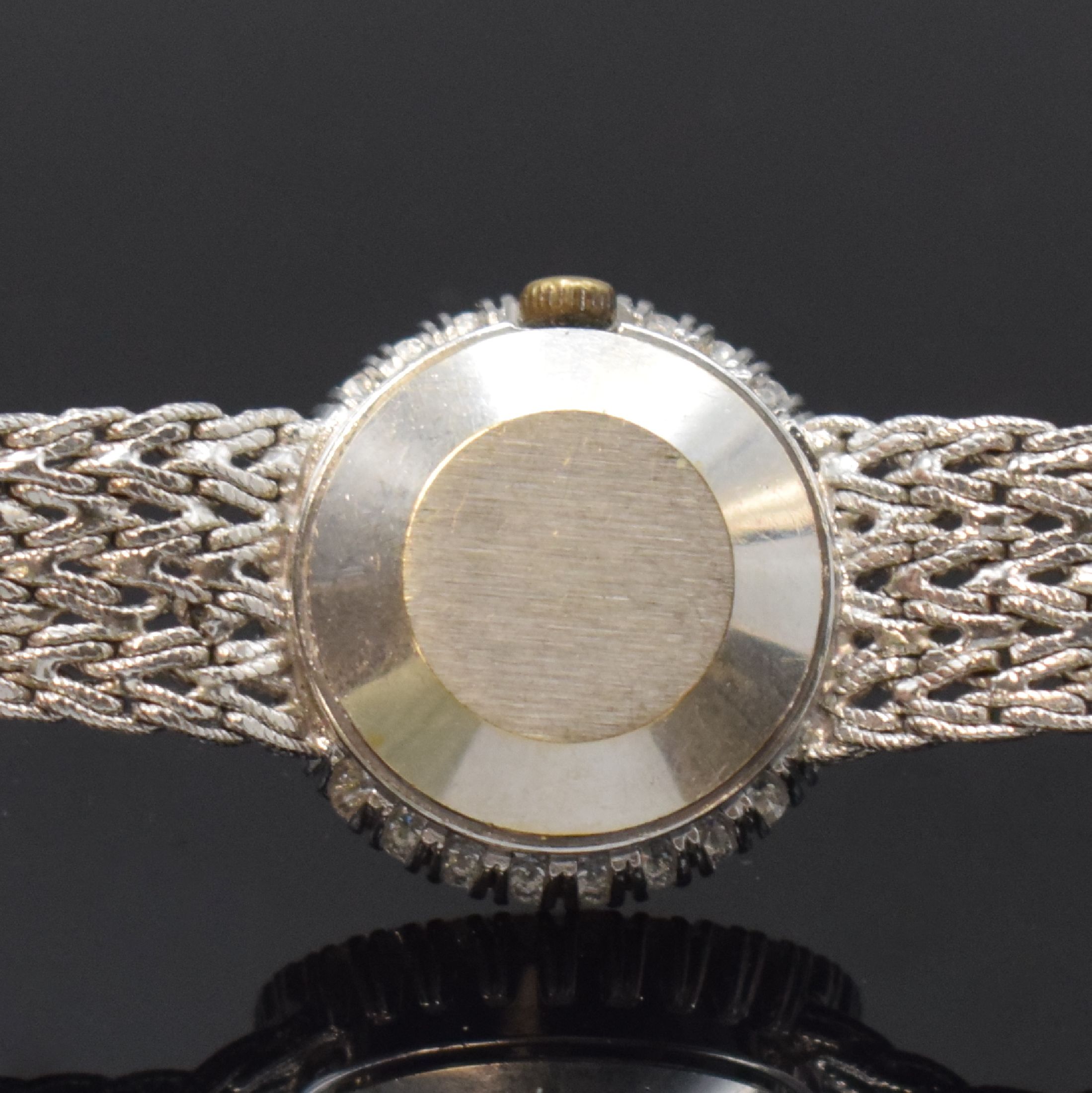 Detail e: TISSOT Damenarmbanduhr in WG 750/000 mit Diamanten, Schweiz um 1965, Handaufzug, Lünette aufw. m. Diamanten bes. (ca. 0,8ct), silb. Zifferbl. stark ...