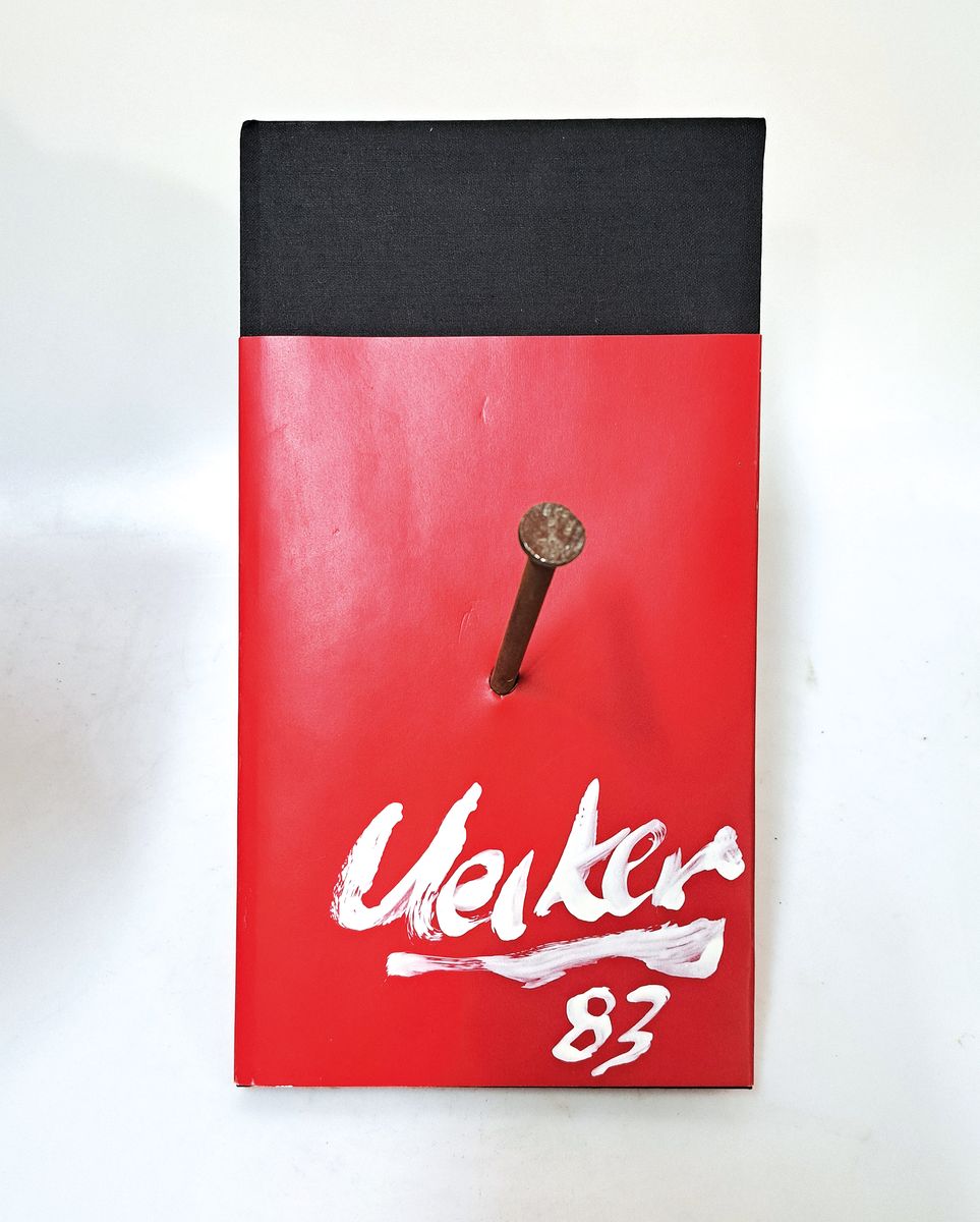 Günther Uecker,geb. 1930, "Kölnisch-Klause (Phobien), Buch von Nagel durchbohrt, sign., dat.83, ca. 11x30x16 cm