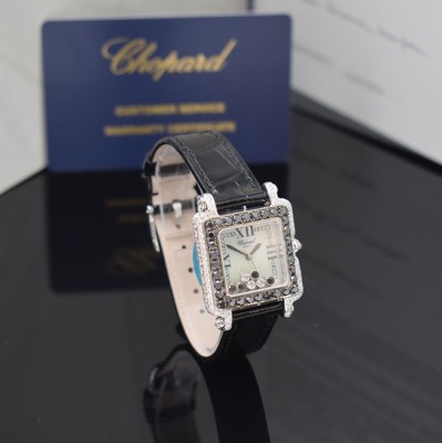 26714585b - CHOPARD Happy Sport 18k white gold ladies wristwatch reference 27/6730-1015 with diamonds, quartz, 3-piece construction case, case back 6-times screwed, case lavish with white and black diamonds set additional approx. 4,64 ct, mobile diamonds under glass additional approx. 0,39 ct, mother of pearl dial, blued steel hands, original leather strap with original 18k white gold buckle, measures approx. 28 x 28 mm, Chopard certificate of authenticity and service warranty from February 2024 enclosed, condition 1