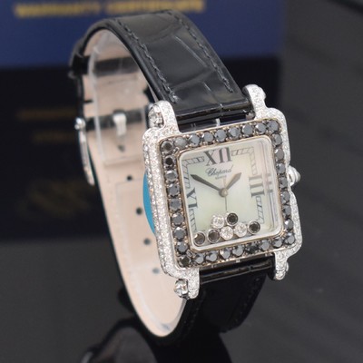 26714585c - CHOPARD Happy Sport 18k white gold ladies wristwatch reference 27/6730-1015 with diamonds, quartz, 3-piece construction case, case back 6-times screwed, case lavish with white and black diamonds set additional approx. 4,64 ct, mobile diamonds under glass additional approx. 0,39 ct, mother of pearl dial, blued steel hands, original leather strap with original 18k white gold buckle, measures approx. 28 x 28 mm, Chopard certificate of authenticity and service warranty from February 2024 enclosed, condition 1