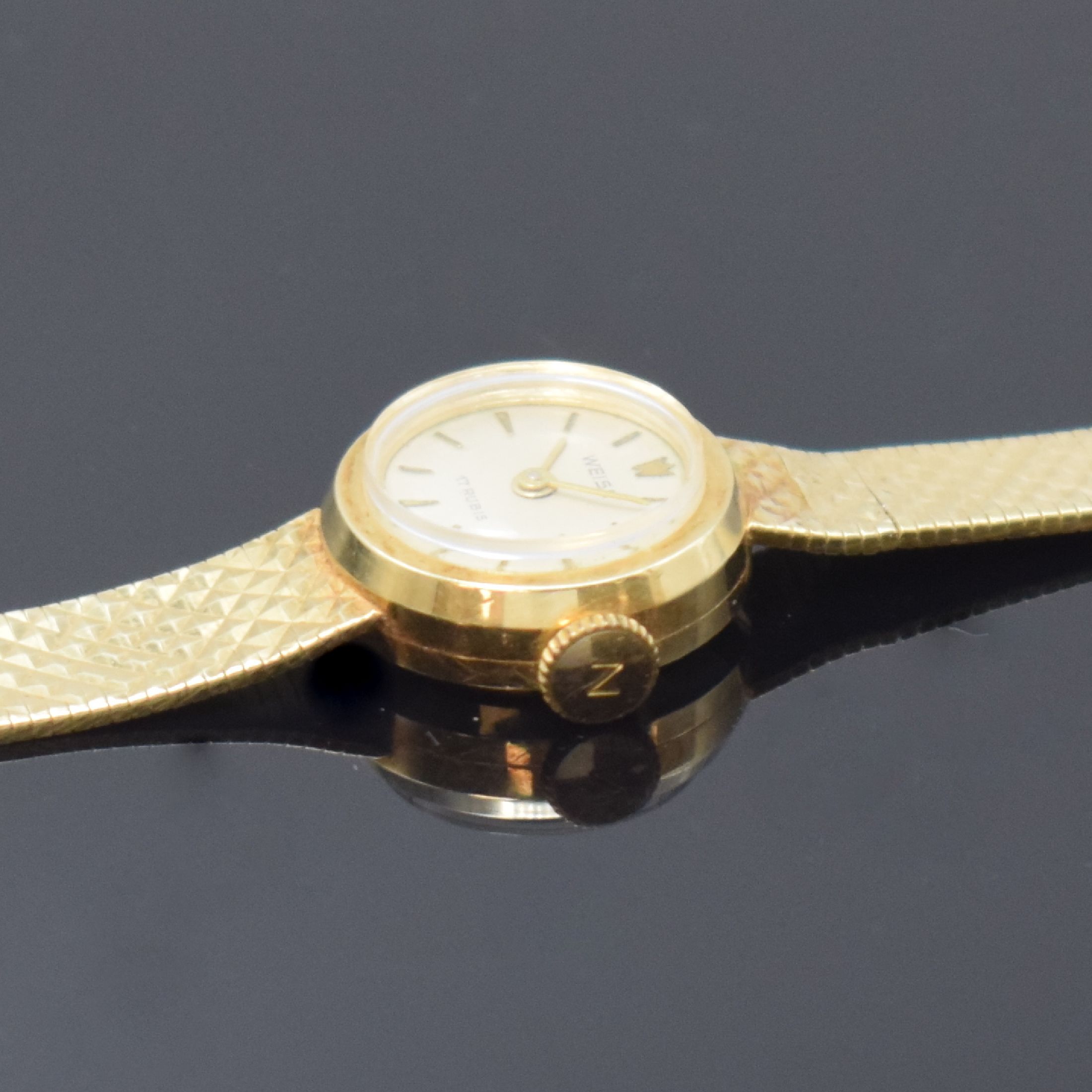 Detail c: WEISS Damenarmbanduhr in GG 585/000, um 1965, Handaufzug, 2-tlg. Geh. m. aufgedr. Boden, anges. Band m. Pyramiden-Struktur, silb. Zifferbl., gold. ...