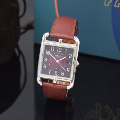 Image 26714933 - HERMES wristwatch series Cape Cod reference CC1.810, stainless steel case including original leather strap with original buckle, quartz, case back 6-times screwed, red dial with Arabic hours, display of hours, minutes, sweep seconds & date, measures approx. 33 x 46 mm, Hermes storage back enclosed, unworn stock, condition 1-2