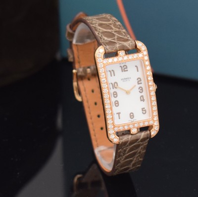 26714969b - HERMES ladies wristwatch series Nantucket reference NA2.271, 18k pink gold including original leather strap with original 18k pink gold buckle, quartz, case back screwed-down 4 -times, case at the sides lavish diamonds set, mother of pearl dial, display of hours & minutes, measures approx. 37 x 20 mm, Hermes storage back enclosed, unworn stock, condition 1-2