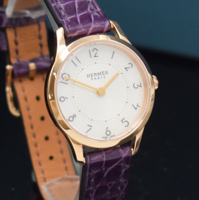 26714987c - HERMES wristwatch series Slim d´Hermes in 18k pink gold reference CA2.170, original leather strap with original 18k pink gold buckle, quartz, snap on case back, silvered, at the edge engine-turned dial with Arabic hours, display of hours & minutes, diameter approx. 25 mm, Hermes storage back enclosed, unworn stock, condition 1-2