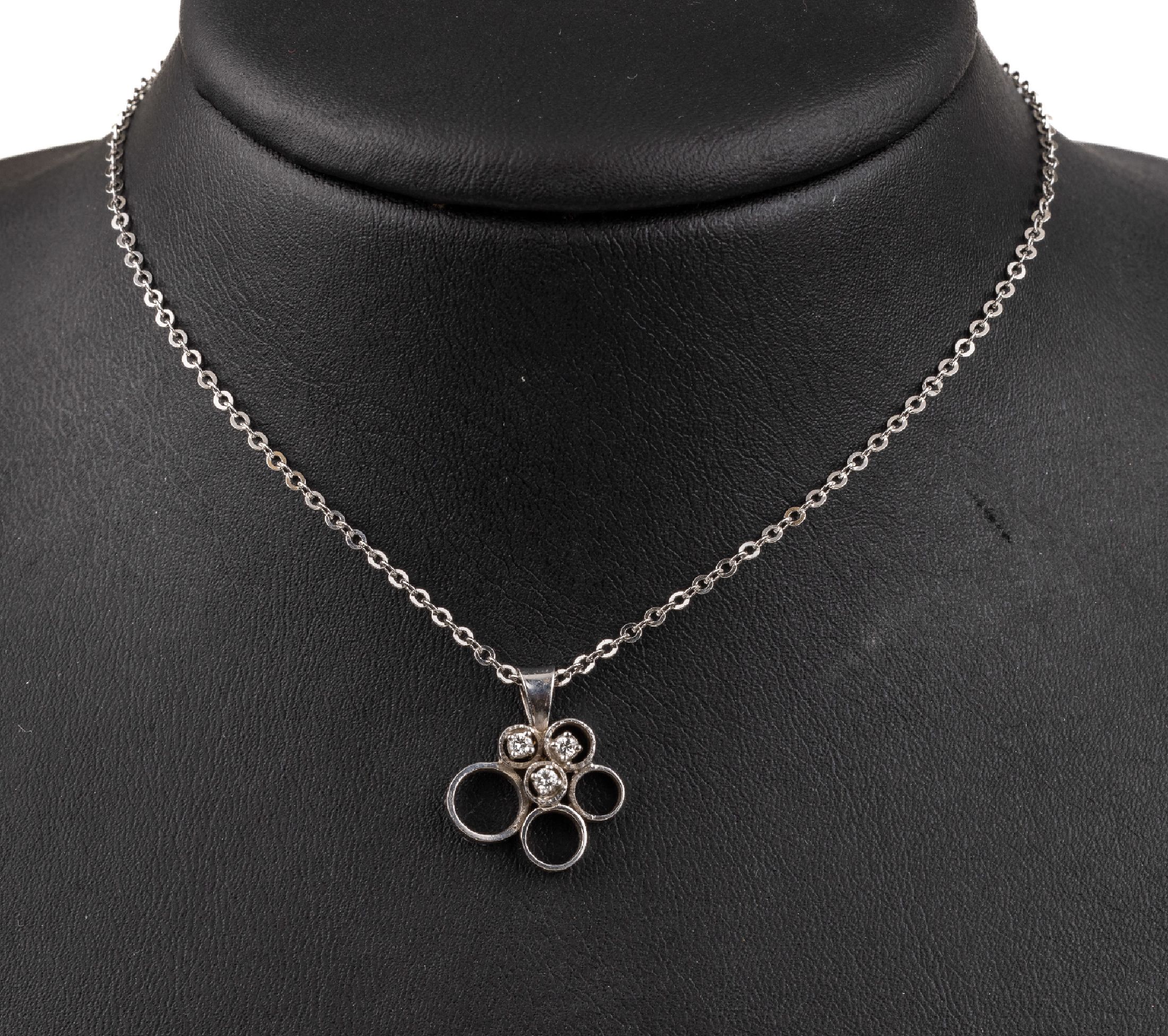 14 kt Gold Brillant-Anhänger, an Kette, WG 585/000, 3 Brillanten zus. ca. 0,10 ct Weiß/si, Kettenl. ca. 34 cm !!, Federringschließe, total ca. ...