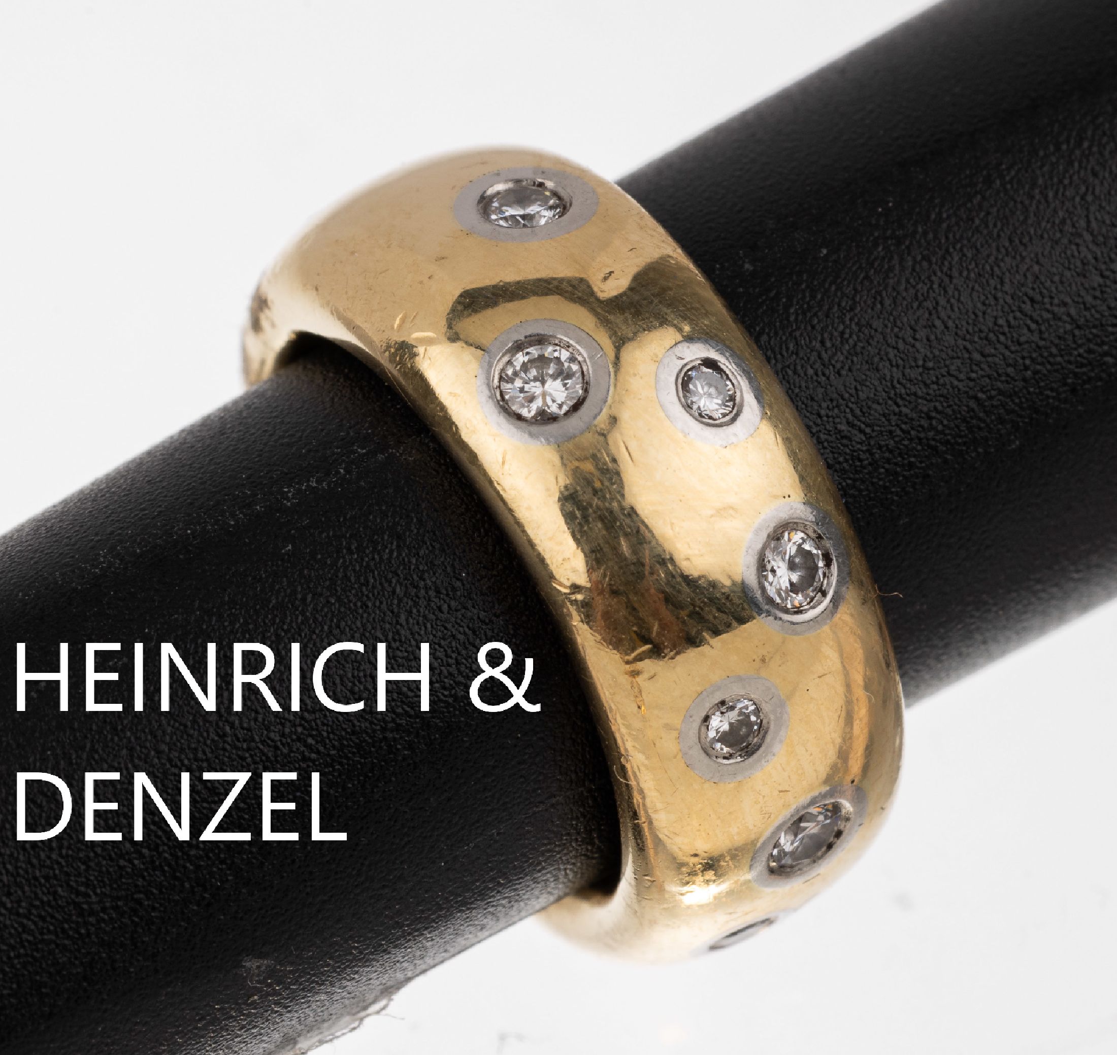 18 kt Gold Brillant Ring HEINRICH & DENZEL, GG 750/000 und Platin 950/000, 15 Brillanten in Platin gefasst zus. ca. 0.60 ct Weiß/si, schwere ...