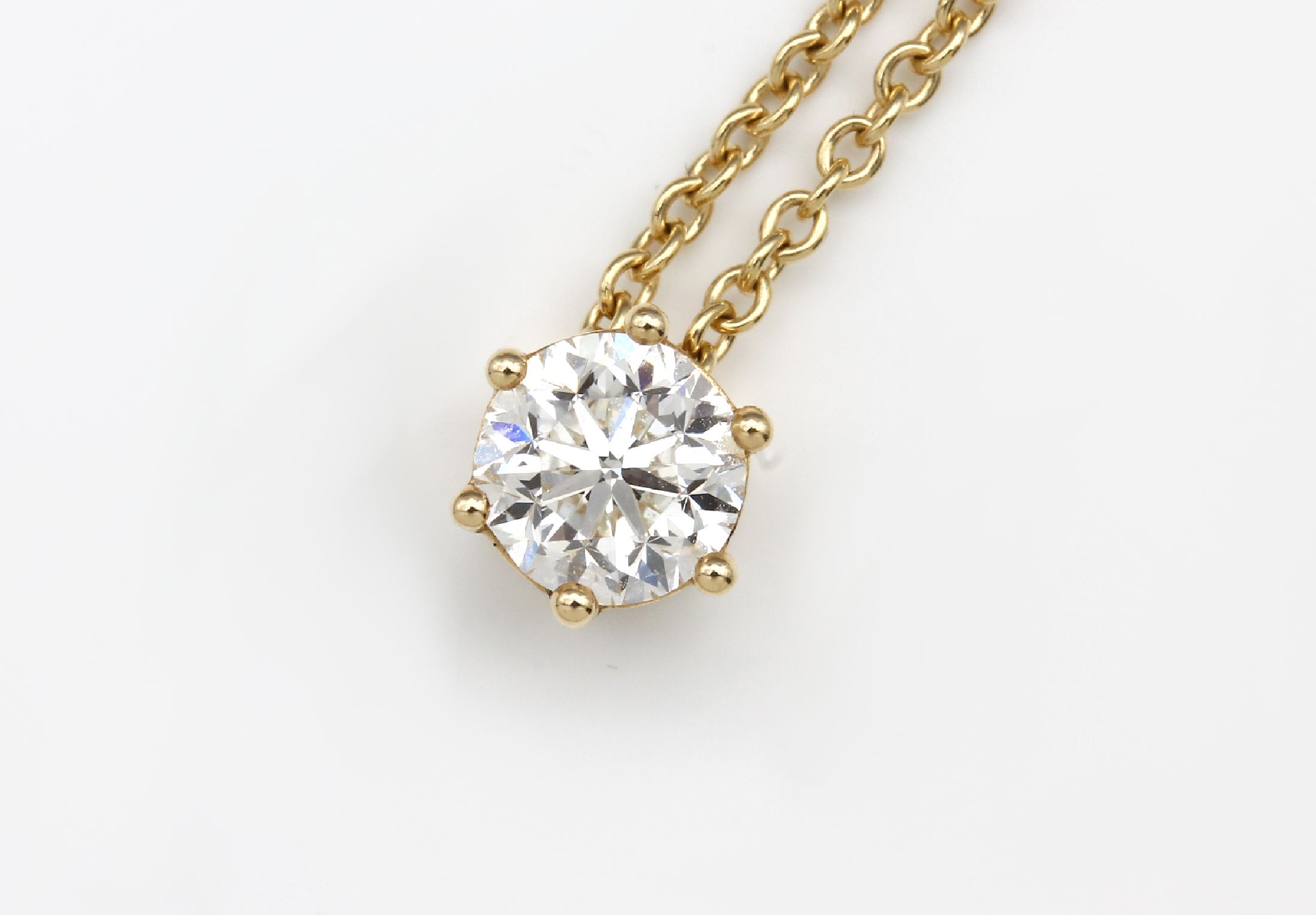 Detail a: 18 kt Gold Brillant Anhänger, GG 750/000, an Kette GG 750/000, Brillant-Solitär 1.00 ct Weiß(H)/vs3, Krappenfassung, L ca. 44 cm, ...