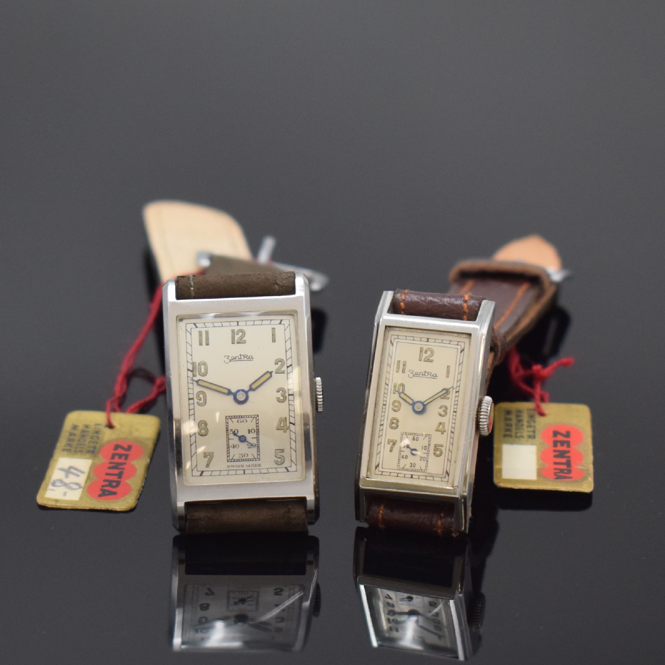 ZENTRA 2 nahezu neuwertige Armbanduhren in Stahl mit Verkaufsschild und original Band, Schweiz um 1940, Handaufzug, aufgedr. Böden, silb. ...