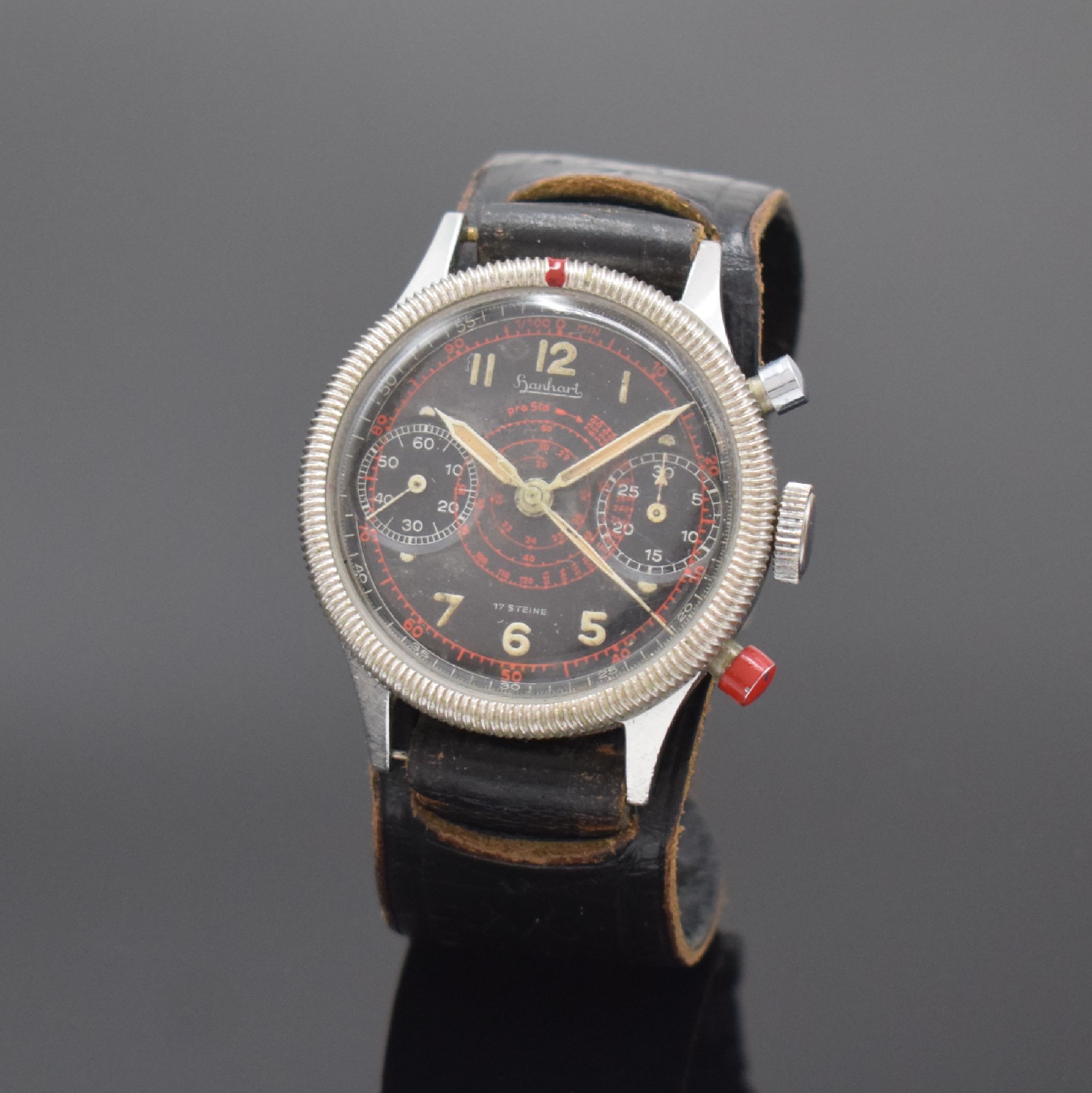 HANHART Flyback Fliegerchronograph in Stahl,Deutschland um 1960, Handaufzug, geriffelte Drehlünette, Boden geschr., schwarzes sehr seltenes ...