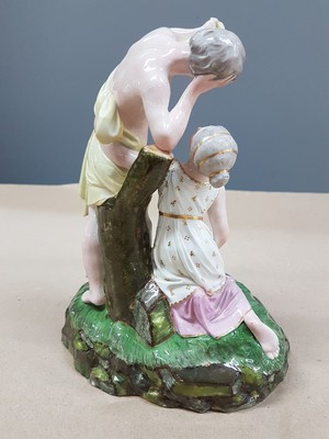 26715828c - Porcelain group "The Killed Pigeon" , Höchst, around 1775, design by Johann Peter Melchior, fine polychrome painting, young girl kneeling in front of a young man, the killed pigeon lies on the grass base, rest., H. approx. 18.5cm, W. approx. 13.2, d. approx. 12.5 cm