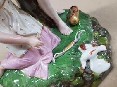 26715828g - Porcelain group "The Killed Pigeon" , Höchst, around 1775, design by Johann Peter Melchior, fine polychrome painting, young girl kneeling in front of a young man, the killed pigeon lies on the grass base, rest., H. approx. 18.5cm, W. approx. 13.2, d. approx. 12.5 cm