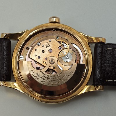 26715841f - OMEGA Constellation 18k yellow gold chronometer wristwatch reference 2943/2954 SC, Switzerland around 1956, self winding, snap on case back with representation observatory, silvered dial patinated/spotty, applied hour- indices, gilded hands, date at 3, copper coloured movement calibre 504, 24 jewels, 5 adjustments, diameter approx. 34,5 mm, signs of use, overhaul recommended at buyer's expense, condition 3