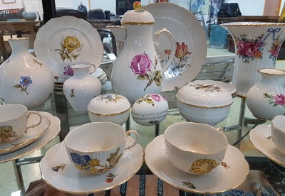 26715881a - Coffee service, Ludwigsburg, 20th century, floral decoration, coffee pot, sugar bowl, 6 cups with saucers, one saucer slightly damaged, lidded box, six dessert plates, with additional parts slightly different in decor: basket bowl, lidded box in egg shape, large flower vase, H. 19 cm, two vases H. 10-17 cm, four small plates, Fürstenberg vase