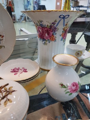 26715881c - Coffee service, Ludwigsburg, 20th century, floral decoration, coffee pot, sugar bowl, 6 cups with saucers, one saucer slightly damaged, lidded box, six dessert plates, with additional parts slightly different in decor: basket bowl, lidded box in egg shape, large flower vase, H. 19 cm, two vases H. 10-17 cm, four small plates, Fürstenberg vase