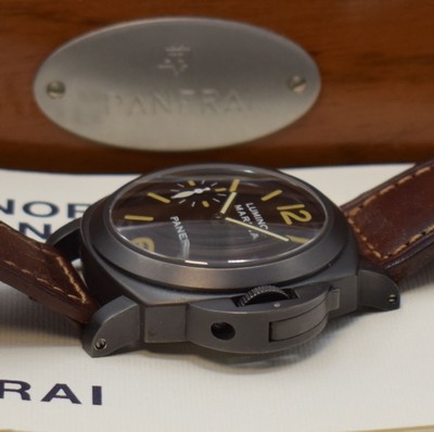 26717187c - PANERAI very rare, limited gents wristwatch Luminor Marina Pre Vendome reference 5218 - 203/A no. 0043, manual winding, produced in a limited edition to 200 pieces, big, cushion shaped, water resistant to 30 ATM, stainless steel PVD-coated, military divers watch with original leather strap and original buckle, 3 piece construction, satine black, case, screwed down case back, straight lugs, windingcrown with patented security lever to wind thewatch under water, sapphire crystal, black dial with luminous Arabic numerals and indices, small Sek at 9, black baton hands, rhodium plated movement, 17 jewels, calibre ETA (UT6497), fausses cotes decoration, monometallic balance, flat hairspring, shock- absorber, measures approx. 44 x 44 mm, original mahogany-box with original covering box, hang tag, additional original leather strap with original buckle and original papers, sold in June 1996, condition 2, one ofthe most sought after Panerai, property of a collector