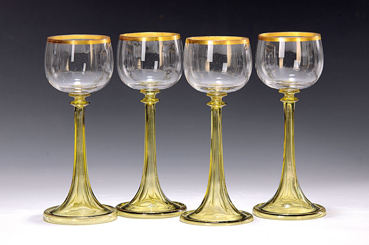 6 Weingläser, wohl Rheinische Glashütte, um 1900, grüner facettiert Fuss, innen hohl, Kuppa farbloses Glas, Goldränder, H. je ca. 18.5cm