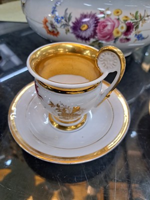 26718492b - 3 Biedermeier cups with saucers, German, mid- 19th century, porcelain, with various colorful floral paintings and wide gold edges, these rubbed, height approx. 8cm each