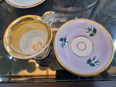 26718492f - 3 Biedermeier cups with saucers, German, mid- 19th century, porcelain, with various colorful floral paintings and wide gold edges, these rubbed, height approx. 8cm each