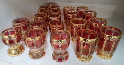 26719003a - 21 glasses, Bohemia, mid-20th century, 13 small goblet glasses and 8 small. Beakers, colorless glass, ruby red fields, gold decoration, height approx. 8/8.5 cm