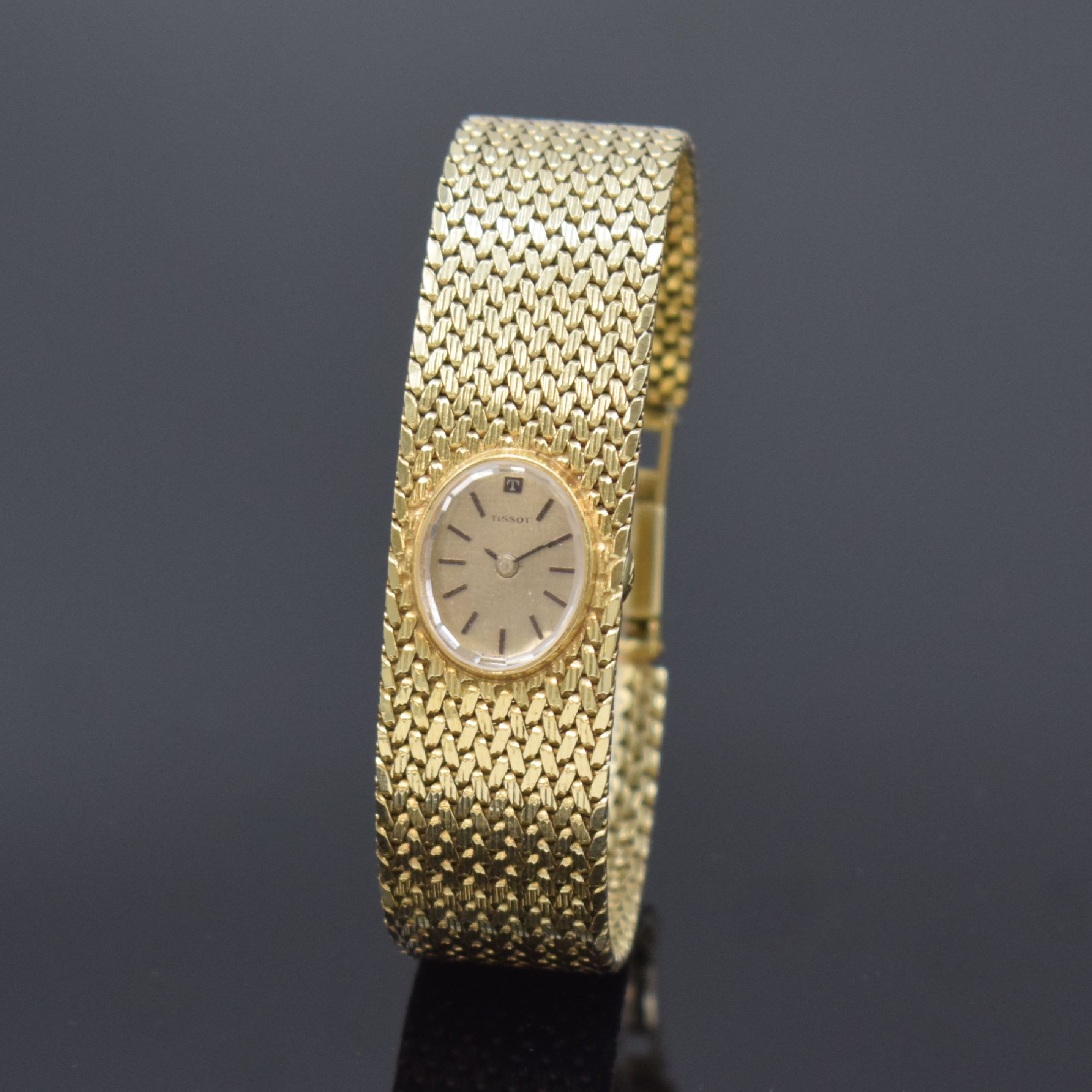 TISSOT Damenarmbanduhr in GG 585/000, Schweiz um 1975, quarz, Boden aufgedr., Zifferbl. m. aufges. Std.-Ind., schwarze Zeiger, D. ca. 17 cm, L. ca. ...