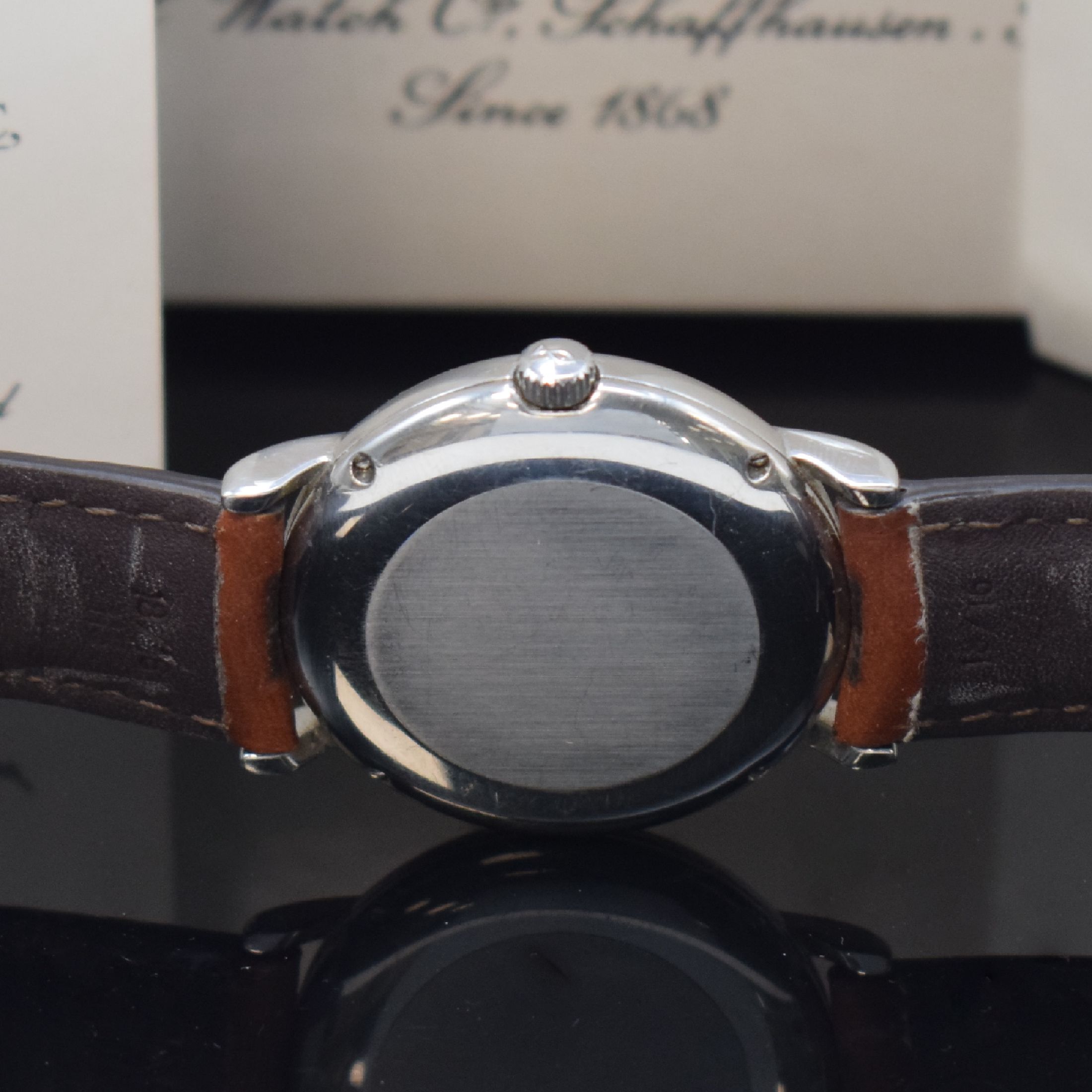 Detail d: IWC Portofino Herrenarmbanduhr Referenz 3513- 026, Schweiz verk. lt. beil. Pap. 09/1991, Automatik, Edelstahlgeh., Boden 4-fach verschr., Lederband ...