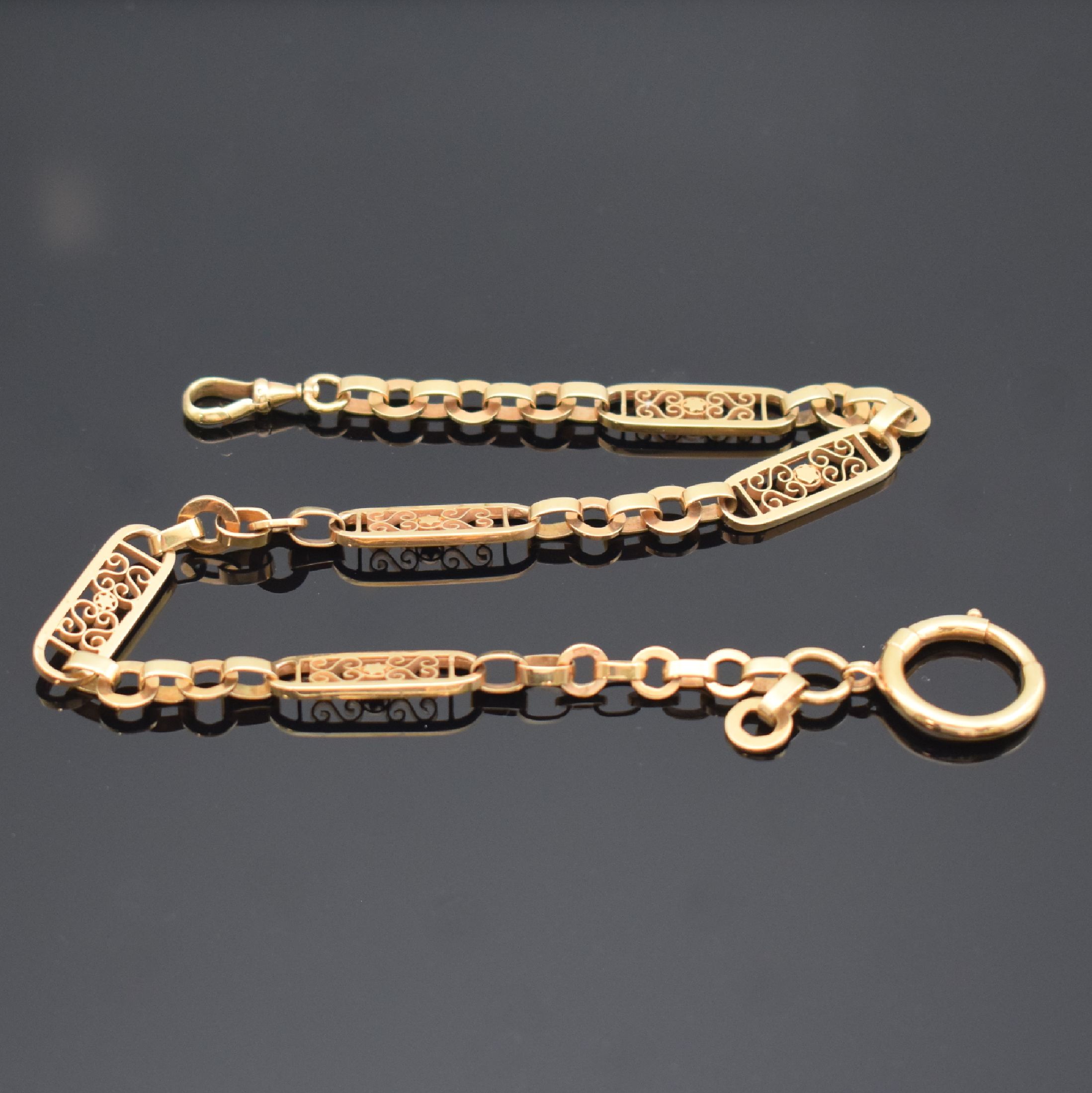 Uhrenkette in RG 585/000 mit filigranen Einzelgliedern, um 1910, Karabiner und Federring, L. ca. 36,5 cm, Gew. ca. 32g, aufwendig verarbeitet