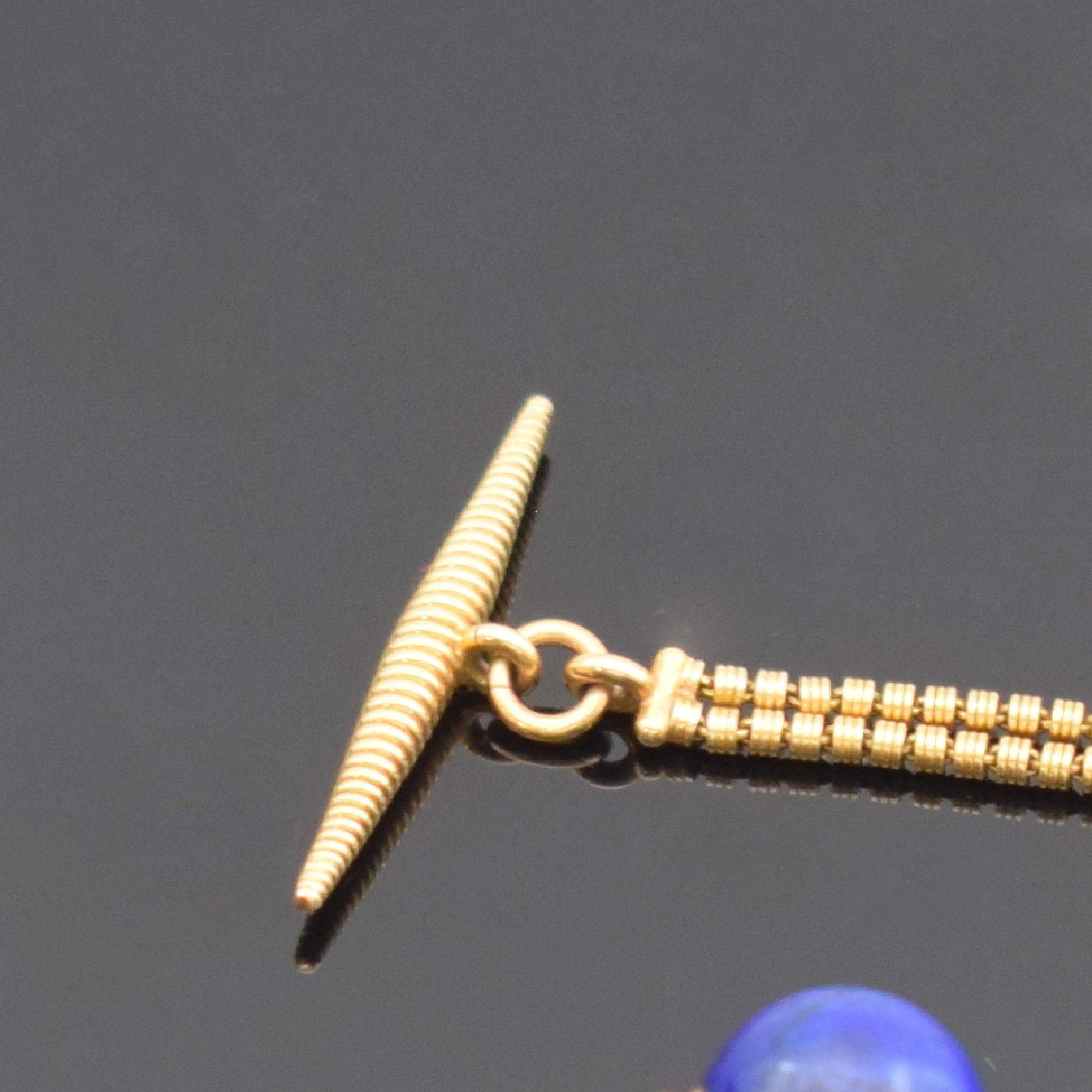 Detail b: Ausgefallen Frack-Uhrenkette in RoseG 585/000, 2-reihig, mit Karabiner und Knebel, in der Mitte mit Lapislazulikugel, L. ca. 22 cm, Gesamtgew. ca. ...