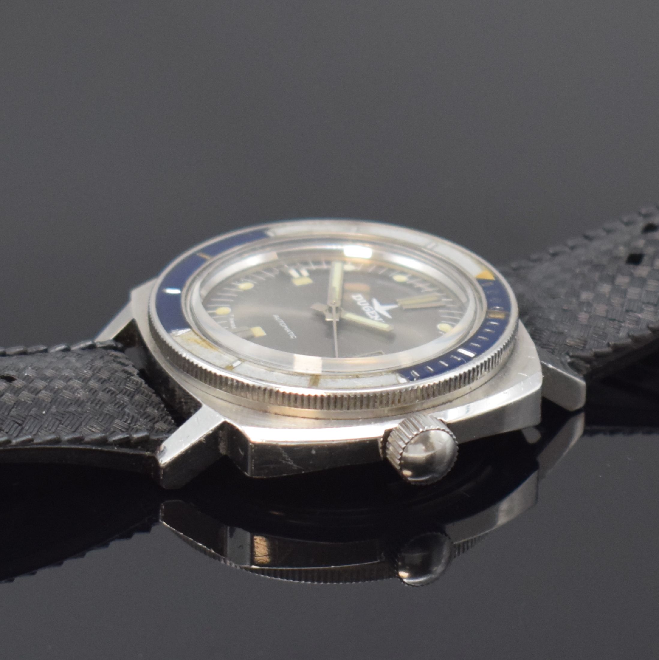 Detail b: DUGENA Armbanduhr im Taucherdesign, Automatik, Schweiz um 1970, Edelstahlgeh. inkl. Kautschukband, Boden und Krone verschr. (Verschraubung d. Krone ...