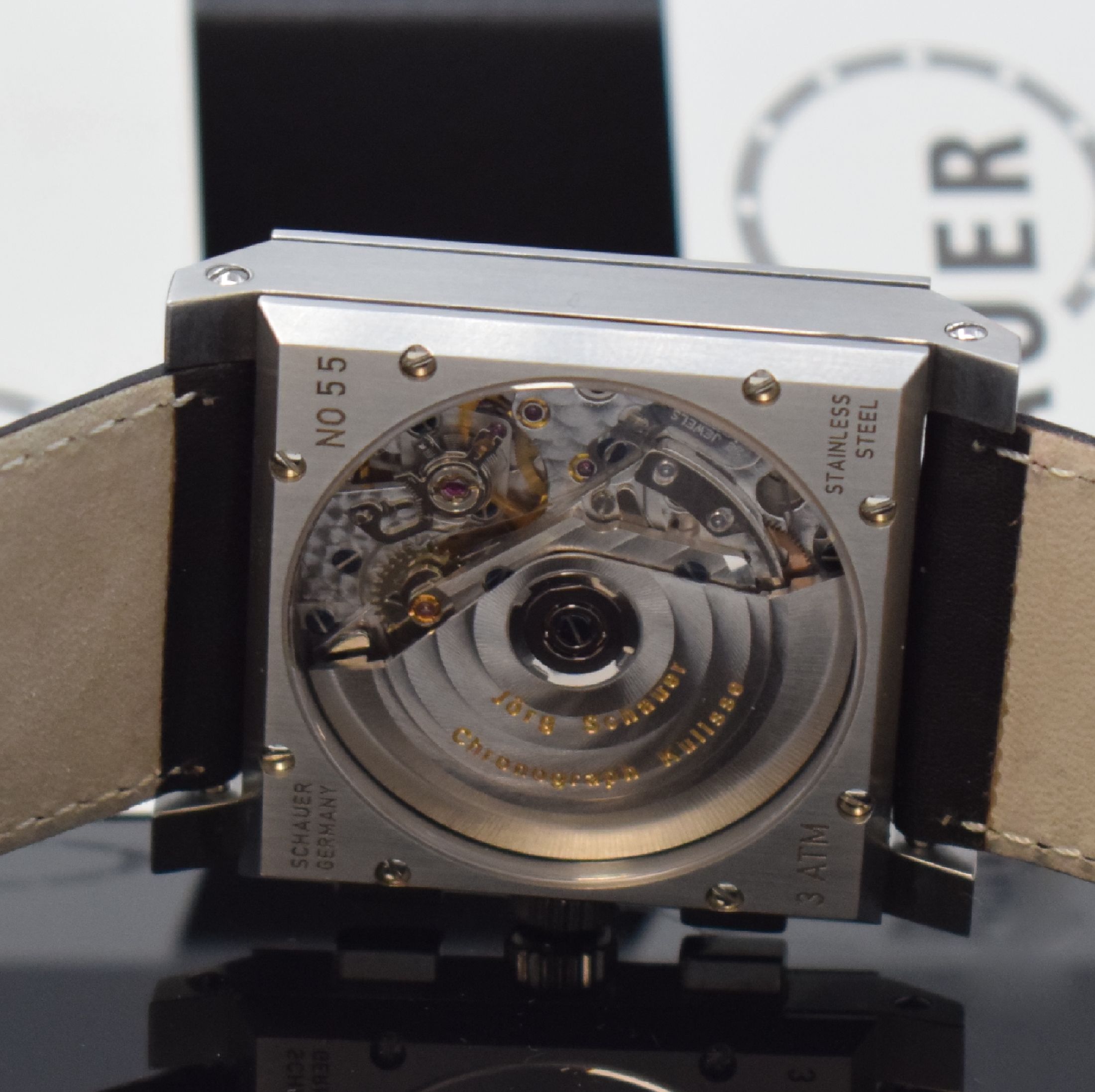 Detail d: JÖRG SCHAUER Quarada Herrenchronograph in Stahl, Deutschland um 2000, Automatik, beids. vergl. Geh., Boden 8-fach verschr., weißes Zifferbl. m. ...