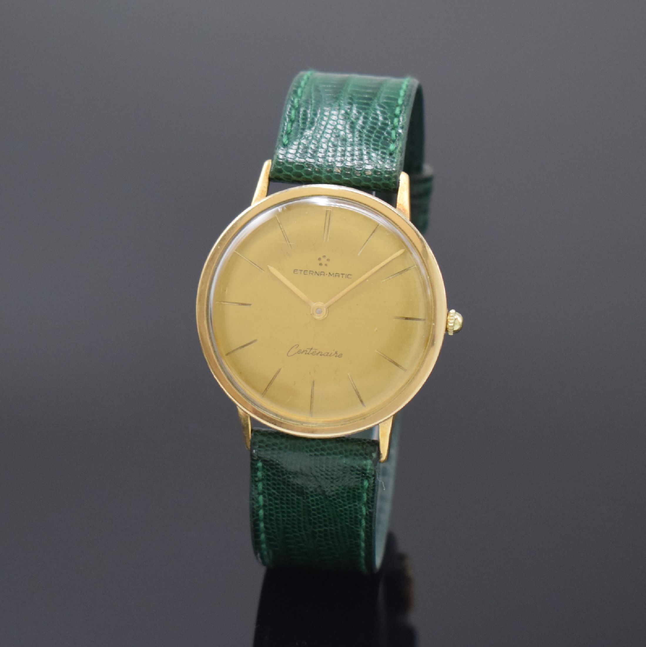 ETERNA-MATIC Centenaire vergoldete Herrenarmbanduhr, Schweiz um 1960, Automatik, Boden u. Glasrand aufgedr., goldfarb. Zifferbl. m. aufges. ...