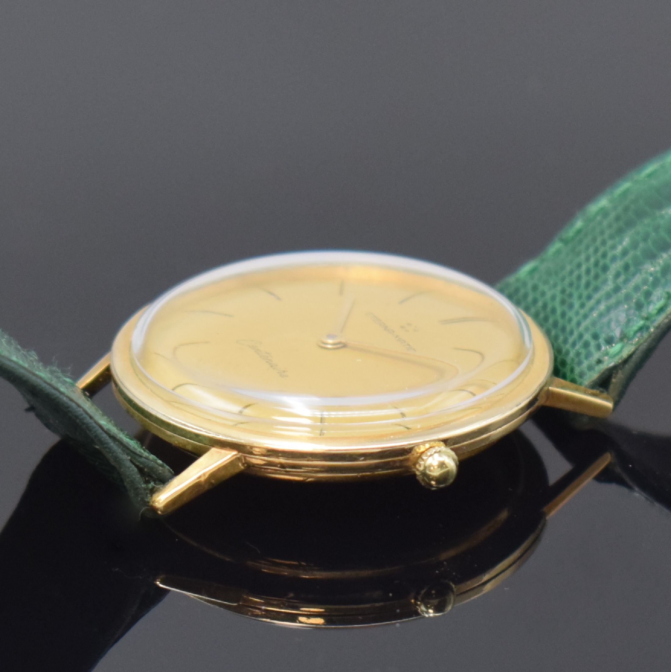 Detail b: ETERNA-MATIC Centenaire vergoldete Herrenarmbanduhr, Schweiz um 1960, Automatik, Boden u. Glasrand aufgedr., goldfarb. Zifferbl. m. aufges. ...