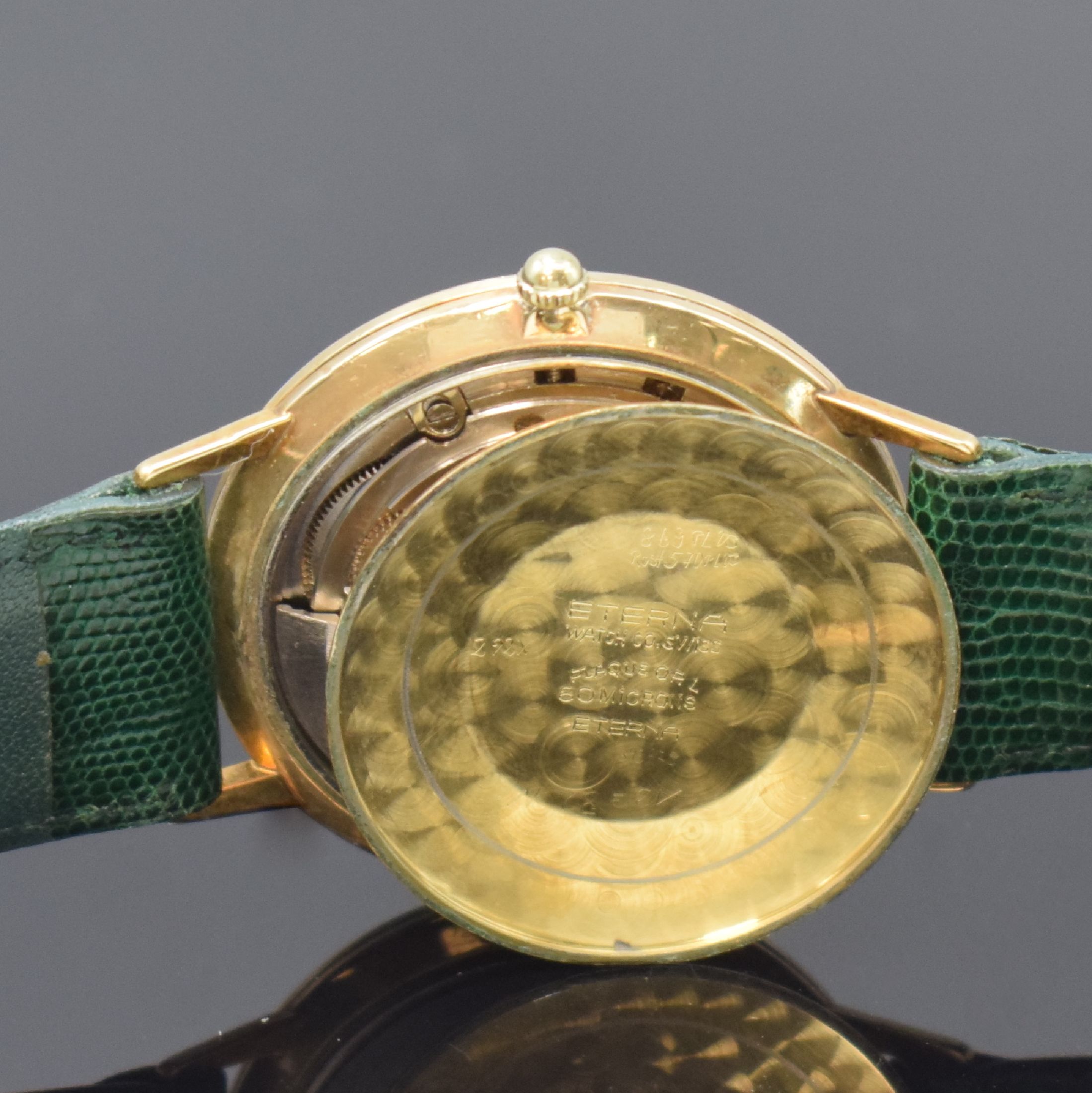 Detail f: ETERNA-MATIC Centenaire vergoldete Herrenarmbanduhr, Schweiz um 1960, Automatik, Boden u. Glasrand aufgedr., goldfarb. Zifferbl. m. aufges. ...